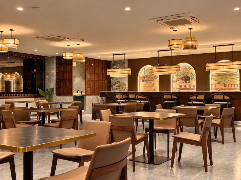 Dining room with canopy pendant lights over the counter, mural arches and teak-panelled walls